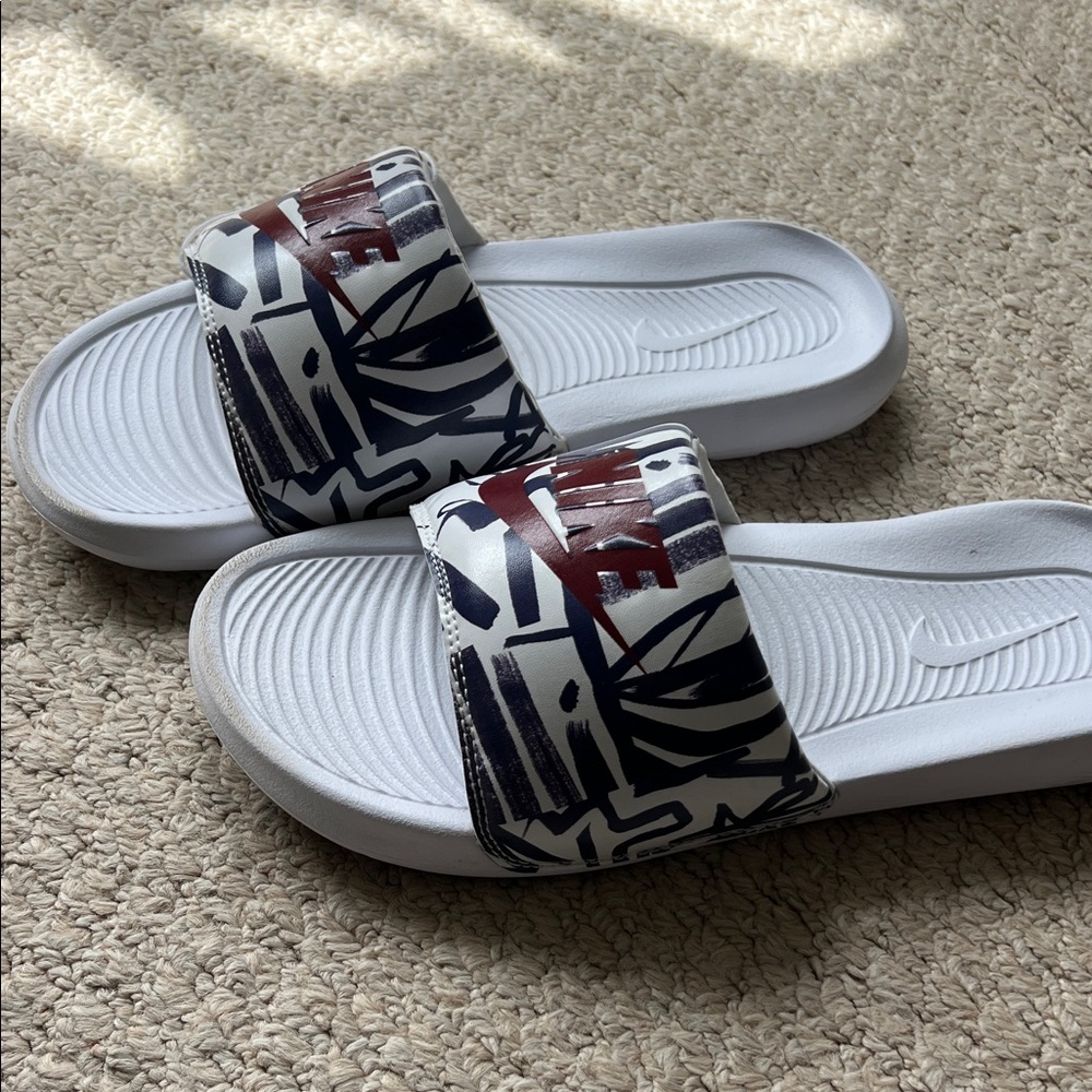 Nike White Slide Sandals with Navy Graphic and Red Logo